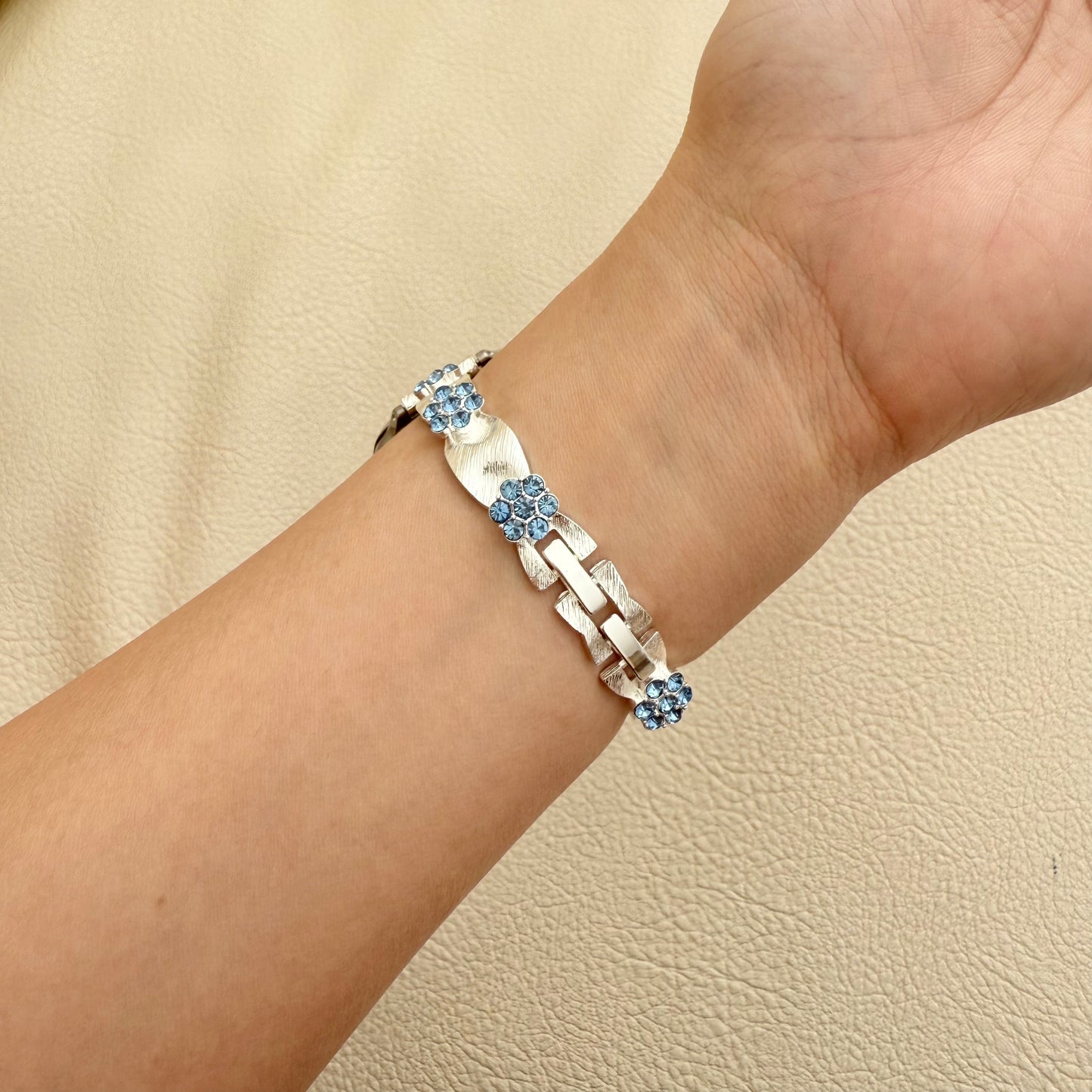 Silver BLUE APPLE WATCH bracelet with blue stones on a wrist