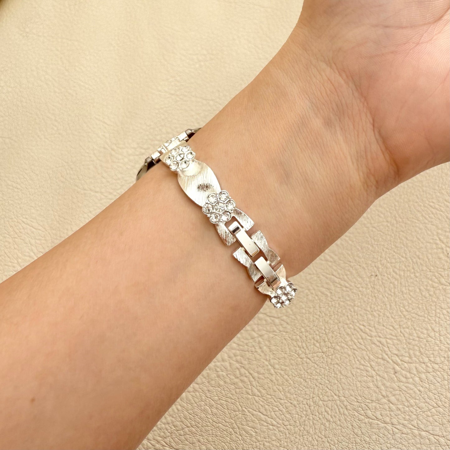 Silver APPLE WATCH bracelet with a diamond on a wrist