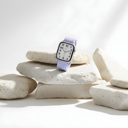 Cloud Nylon Apple Watch Band in lavender on a stack of white stones