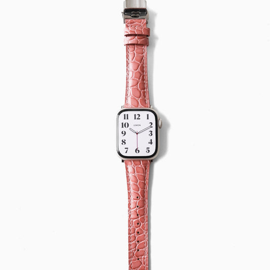 APPLE Watch with a pink crocodile-patterned strap 