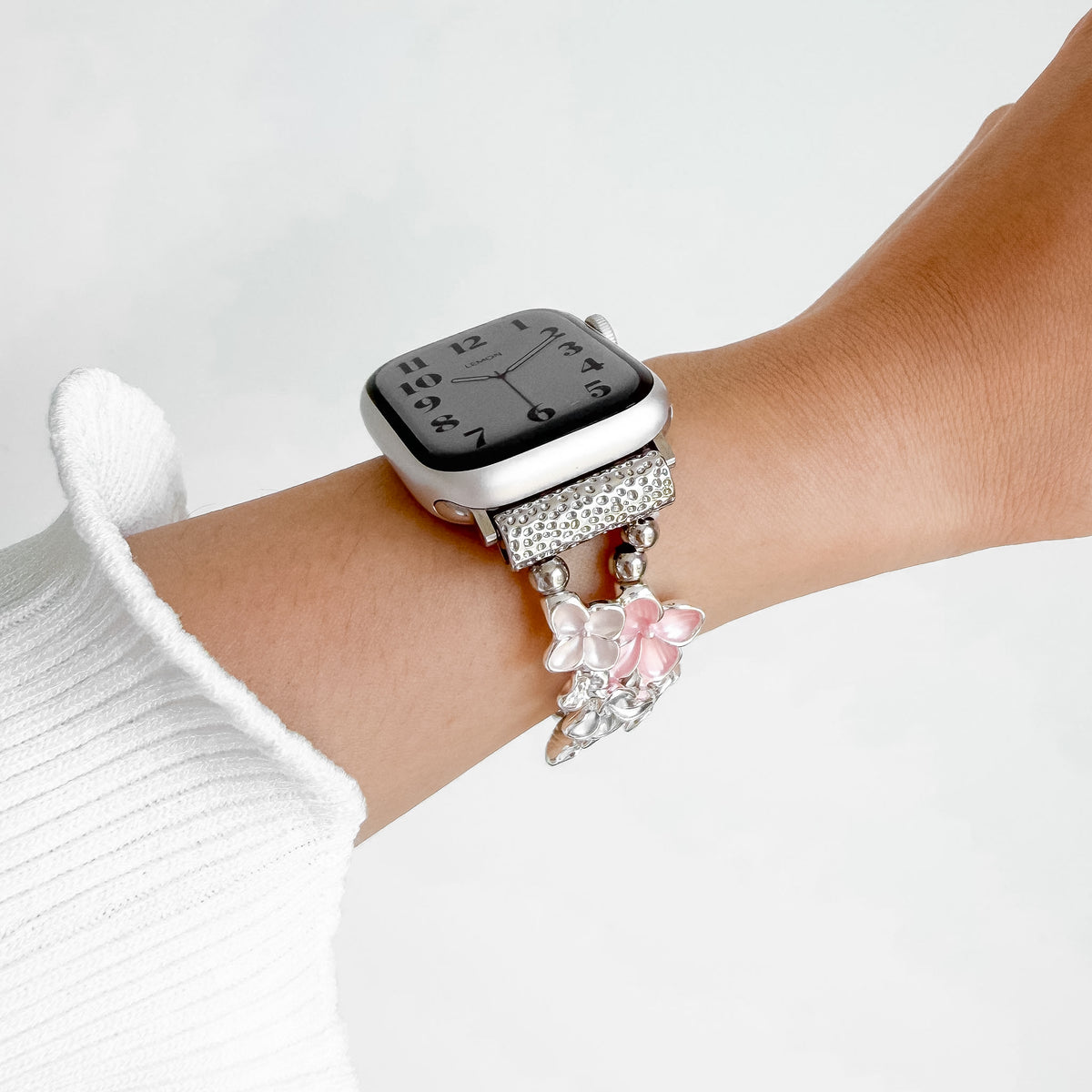 Bloom Apple Watch Bracelet in Light Pink worn on wrist