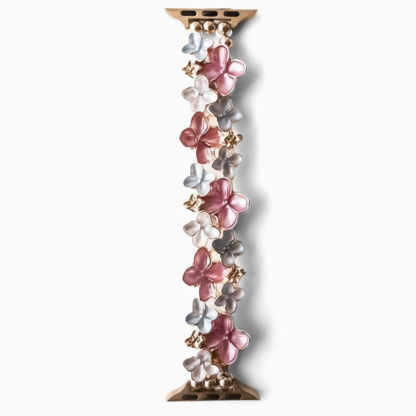 A pink floral Apple Watch bracelet with silver and gold accents.