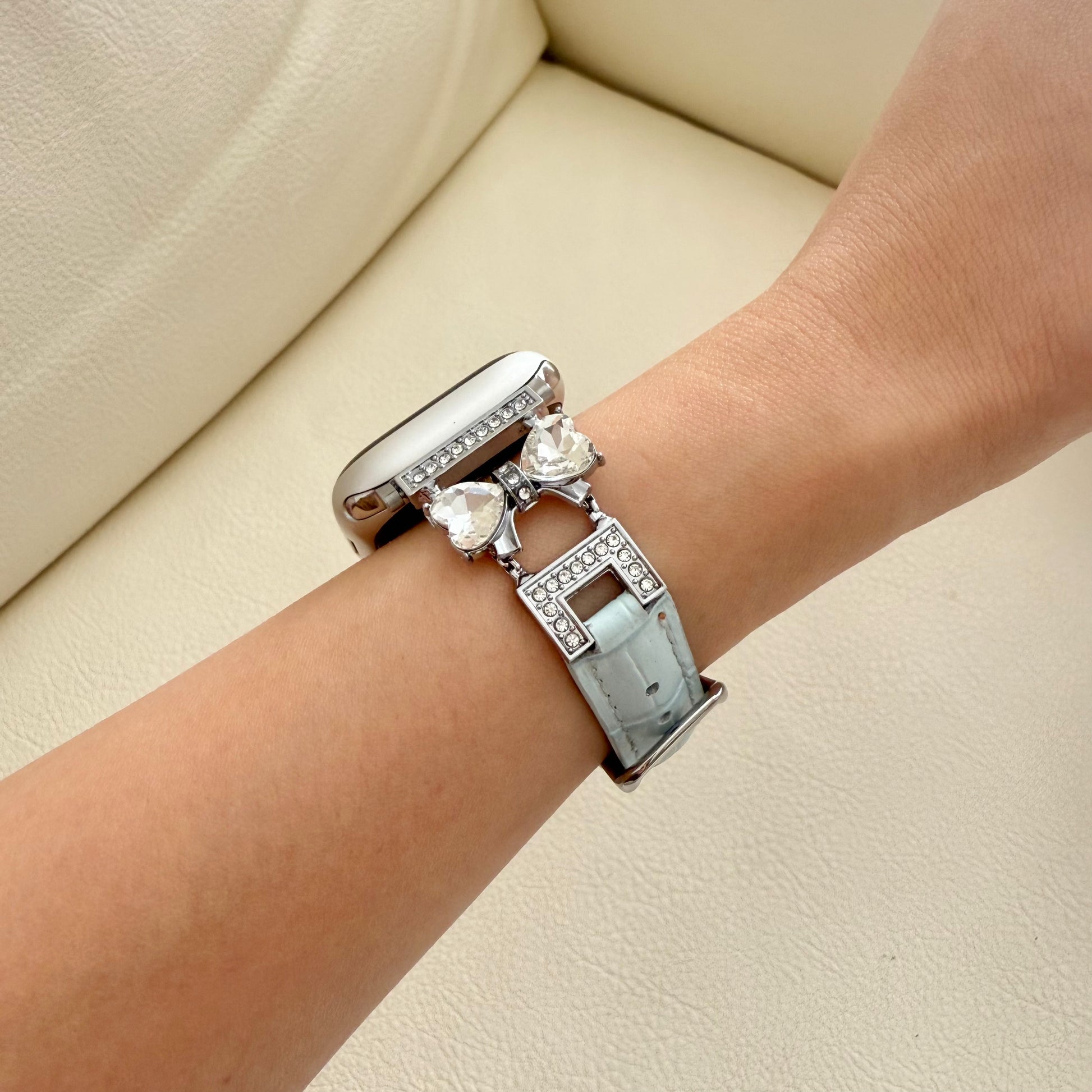 Silver apple watch bracelet with heart-shaped charms