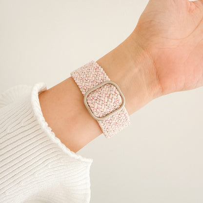 Cloud Nylon Sakura Apple Watch Band worn on wrist with a white knit sleeve, angled view