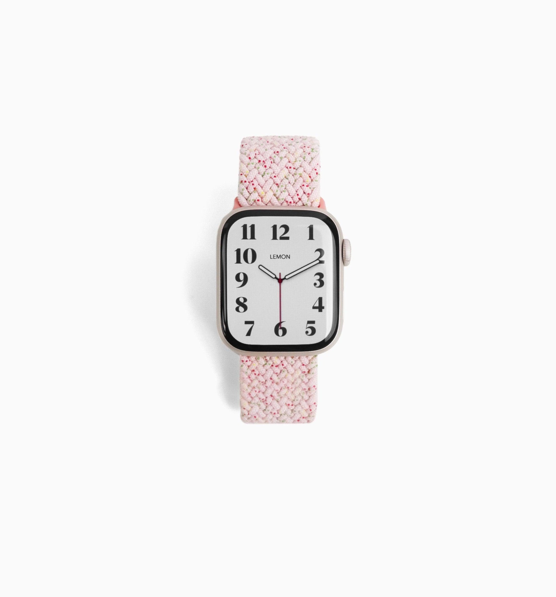 A pink cloud nylon Apple Watch band with a pattern, displayed on a white background.
