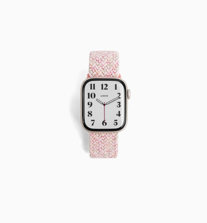 Cloud Nylon Apple Watch Band in sakura pink, braided stretch band, watch face view on white