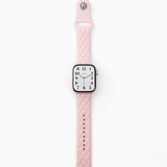 A pink lattice-patterned rubber band for Apple Watch.