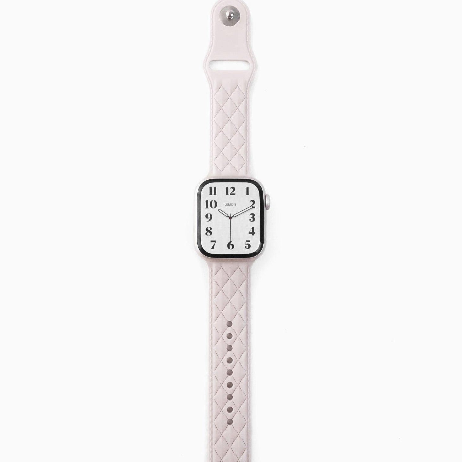 A white lattice-patterned rubber band for Apple Watch, displayed on a white background.
