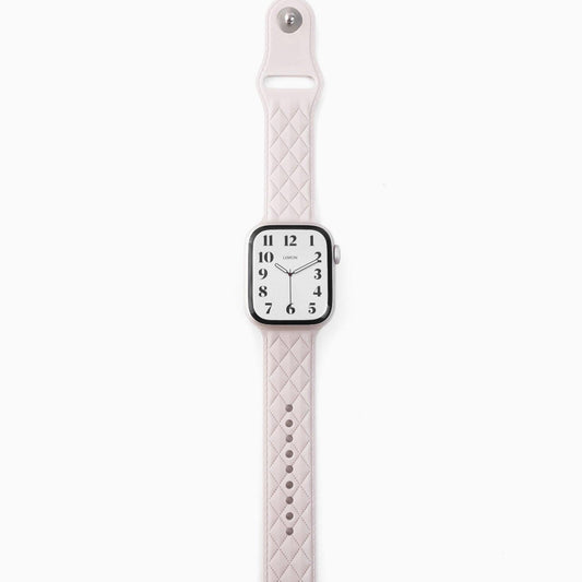 A white lattice-patterned rubber band for Apple Watch, displayed on a white background.