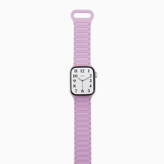 A purple silicone band for an Apple Watch with a magnetic loop attachment.