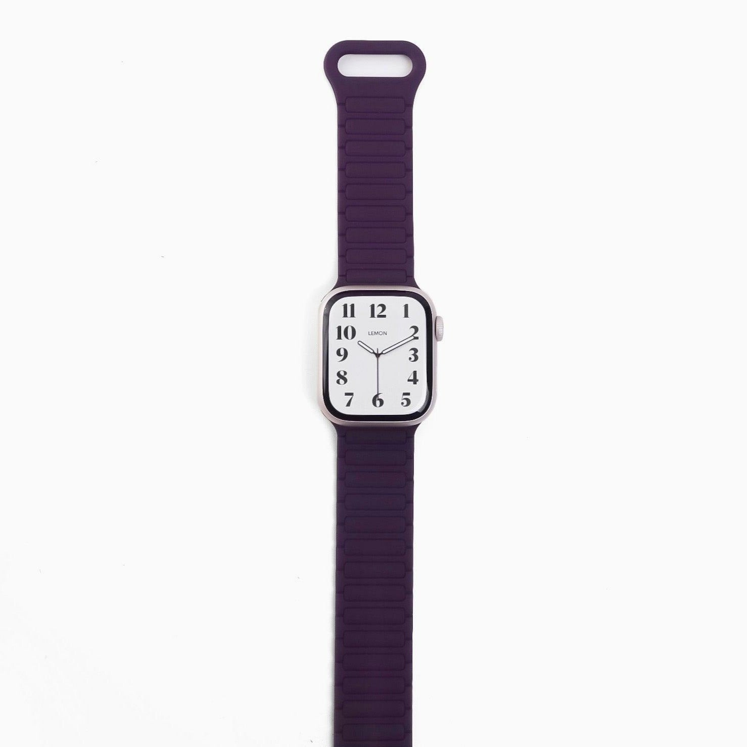 A purple silicone band for an Apple Watch with a magnetic loop attachment.
