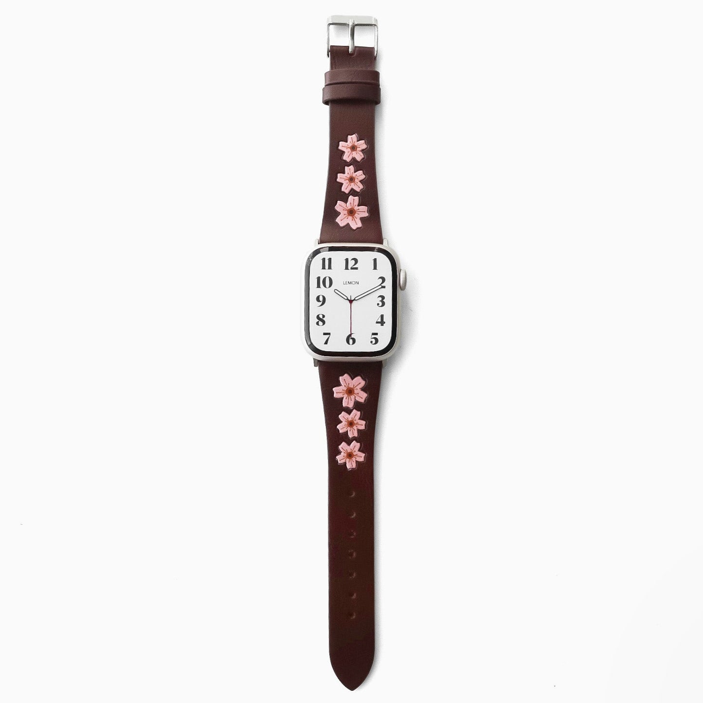 Watch with a brown strap featuring pink floral designs 