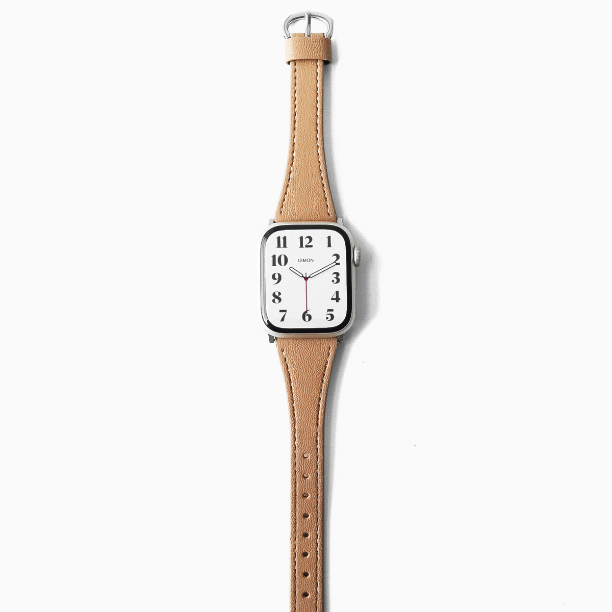 A minimalist analog watch with a square white dial and a light tan leather apple strap, shown vertically against a clean white background.