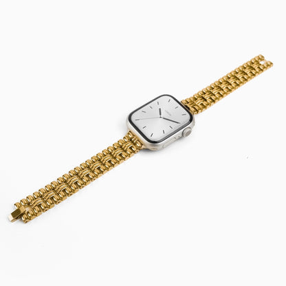 Flowerwall Apple Watch Band in 18k gold plated stainless steel, angled view of the bracelet on white