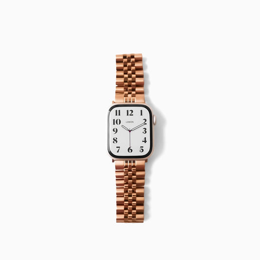 A rose gold stainless steel watch band designed for Apple Watch, showcasing a brushed texture with polished accents.