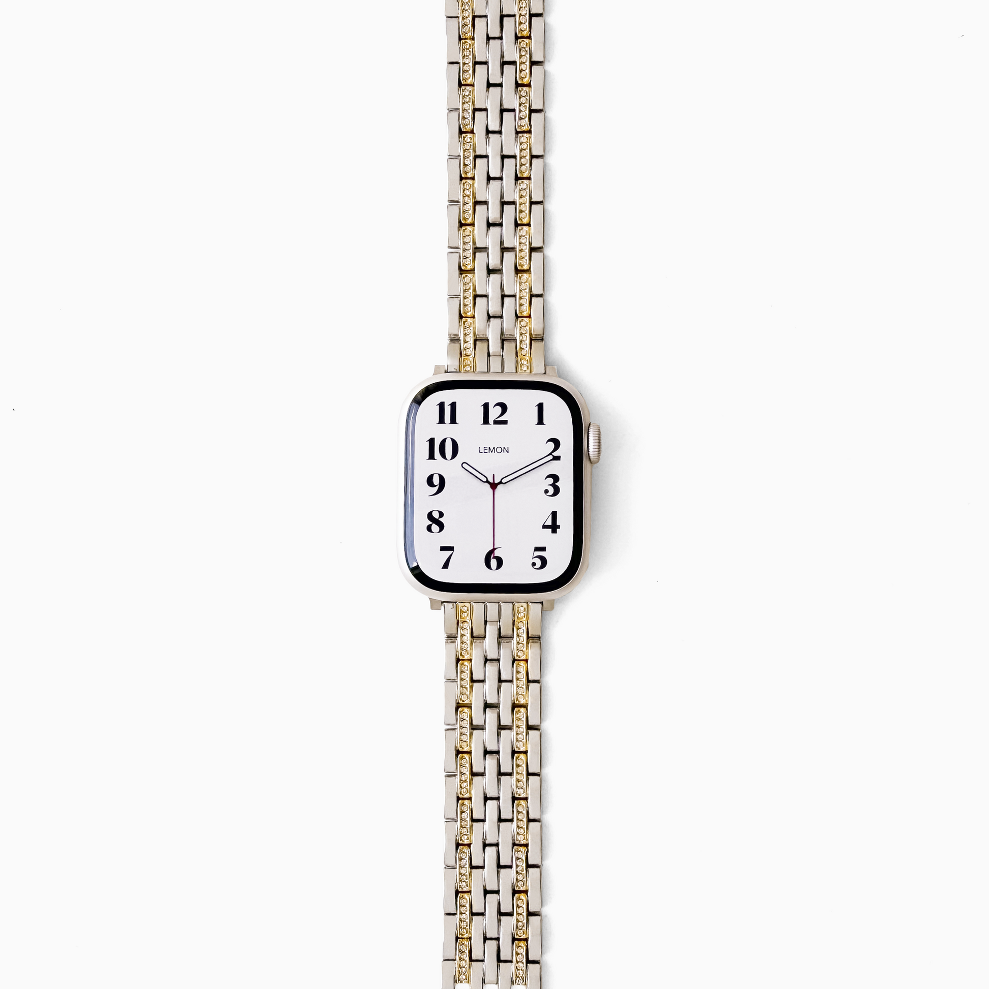 A square-faced analog watch with a white dial and a two-tone metal link band in silver and gold