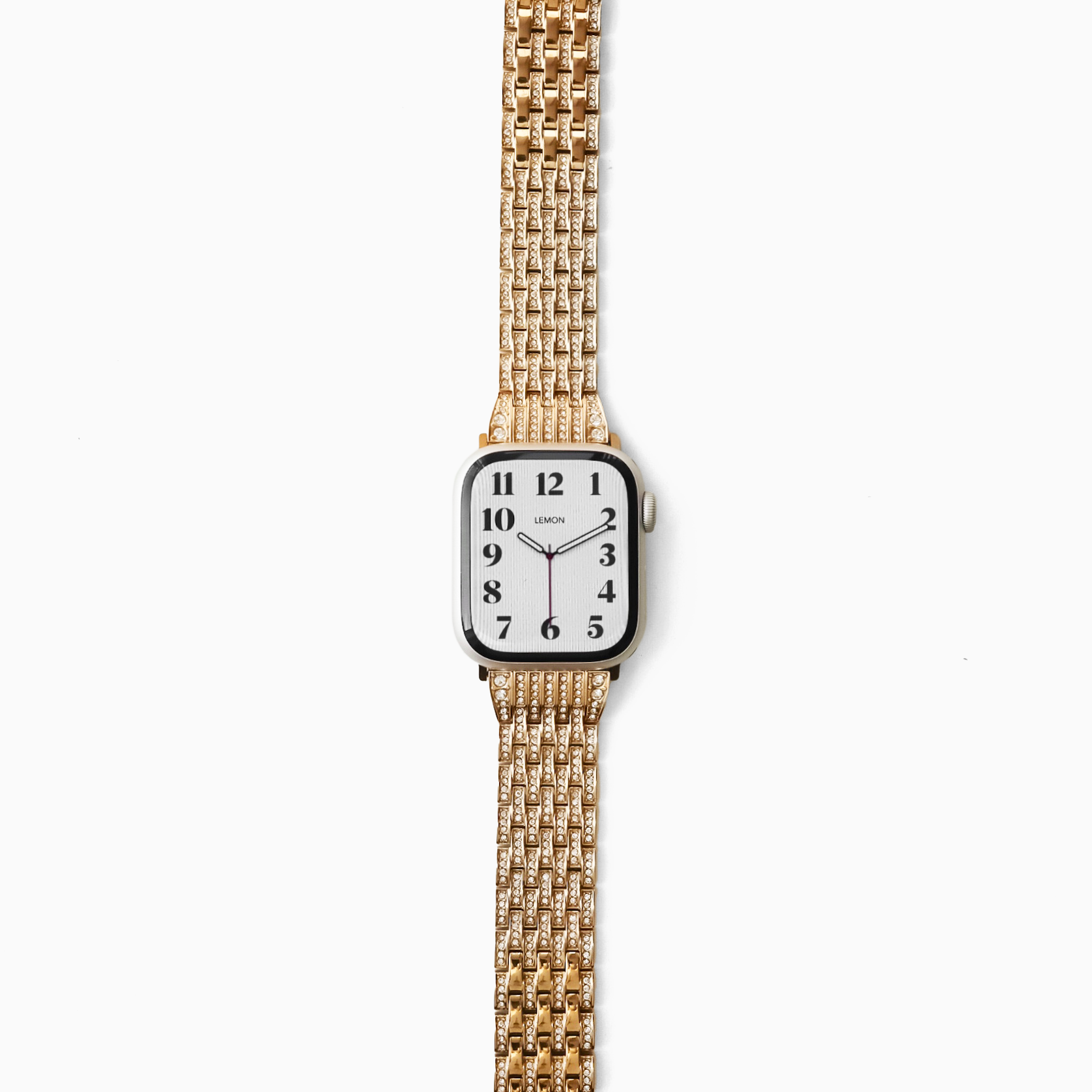 Gold watch with a white face on a white background