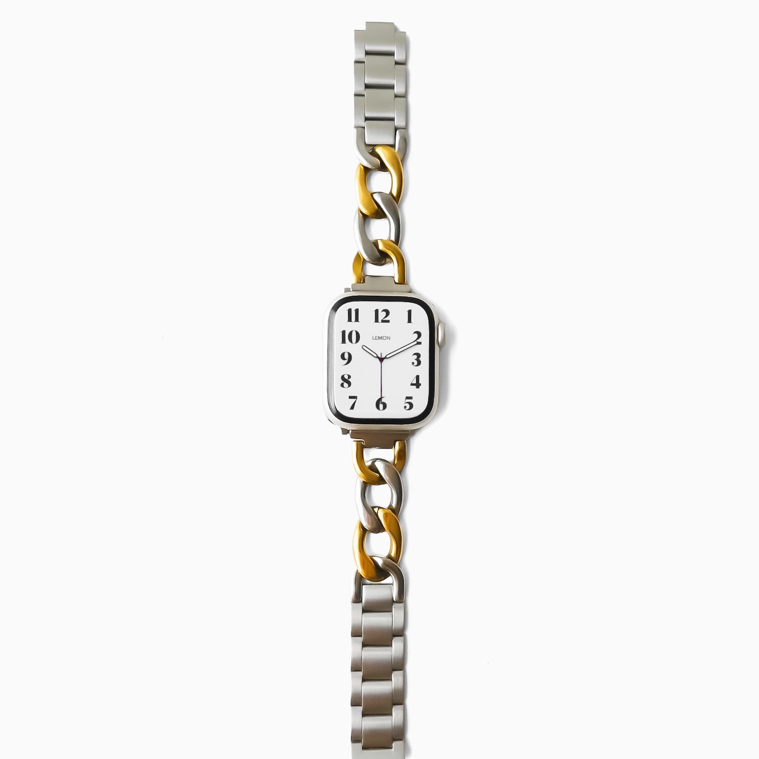 Wristwatch with a silver and gold metal band on a white background