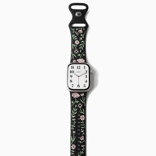 APPLE Watch with floral design on a black strap 