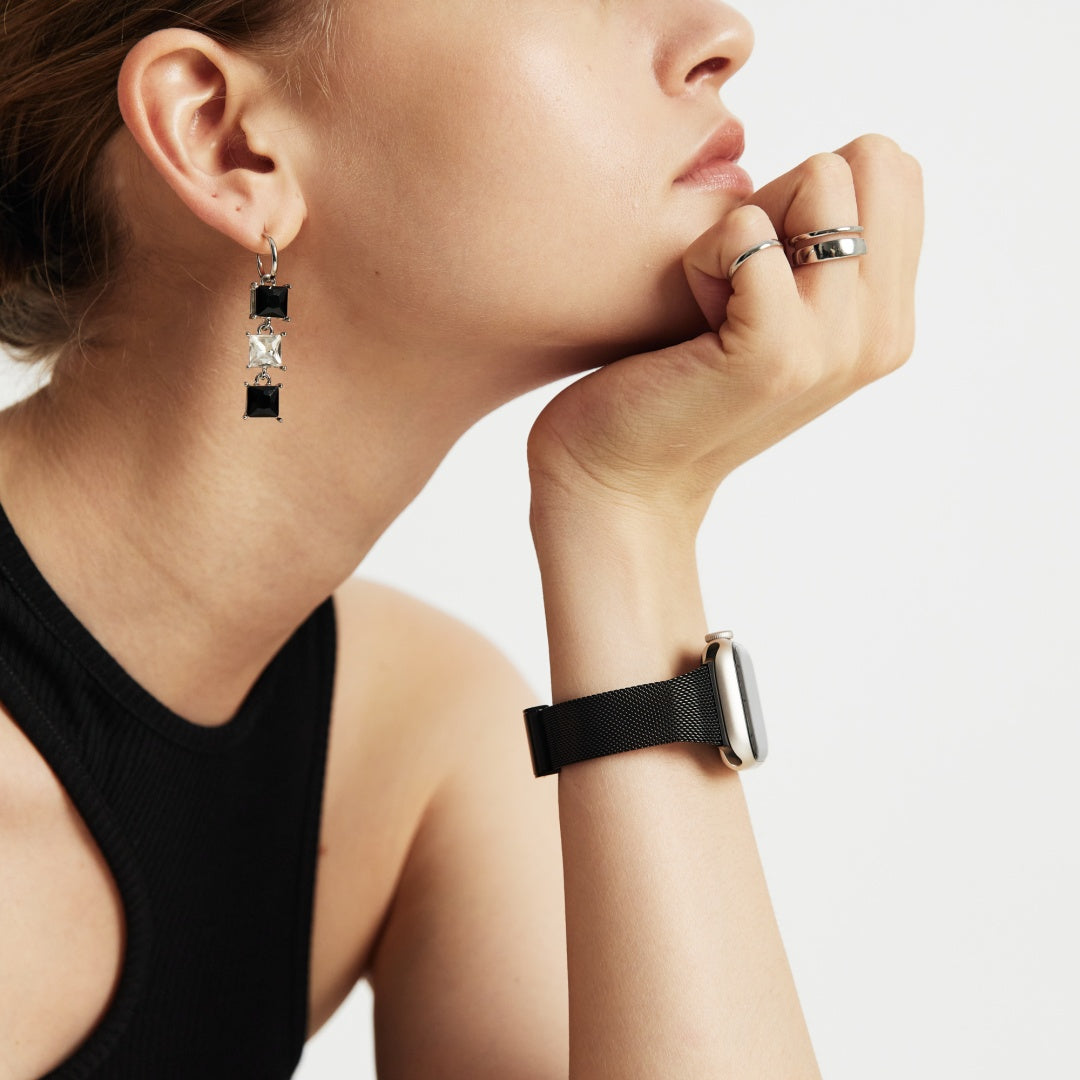 Close-up of a woman wearing black APPLE  watch STRAP