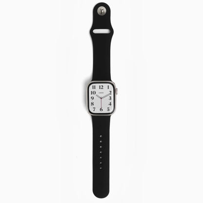 Classic Silicone Apple Watch Band in black with watch attached, front view on white
