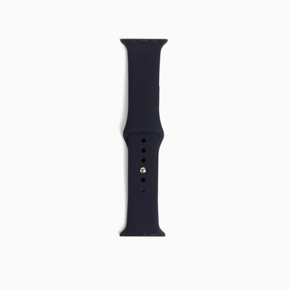 Classic Silicone Apple Watch Band in black, single band half with pin holes on white