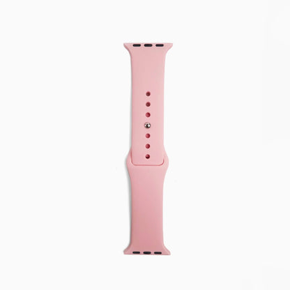 Classic Silicone Apple Watch Band in pink, single band half with pin holes on white