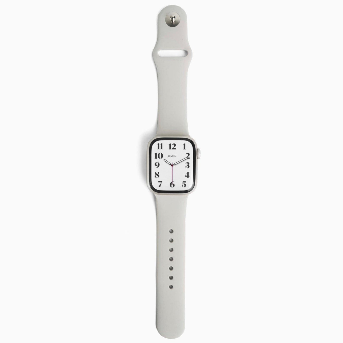 A starlight classic rubber band Apple Watch band displayed on a watch, with a silver buckle and analog watch face.
