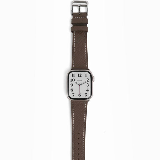 An olive brown textured leather Apple Watch band with a silver metal clasp and buckle, displayed on a white background.