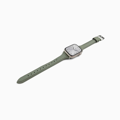 Classic Leather Apple Watch Band in prairie green, laid at an angle on white