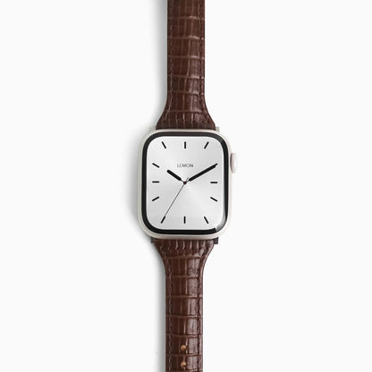 Voyage Leather Apple Watch Band in dark brown croc-embossed leather, front view on white