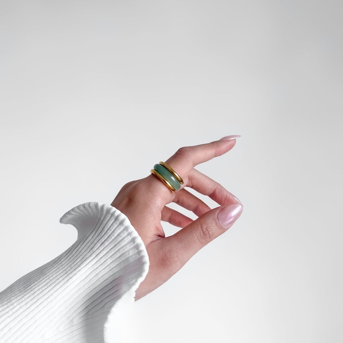 Matcha Ring Set on a pointing hand, side view of the green stone band and gold rings