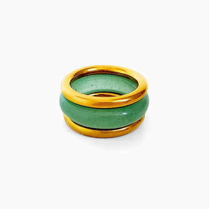 Matcha Ring Set, a pale green stone band stacked between two smooth gold-tone rings, on a white background