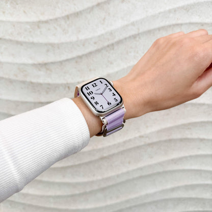 Mountain Nylon Apple Watch Band in starlight and lavender worn on wrist with a white knit sleeve, watch face view