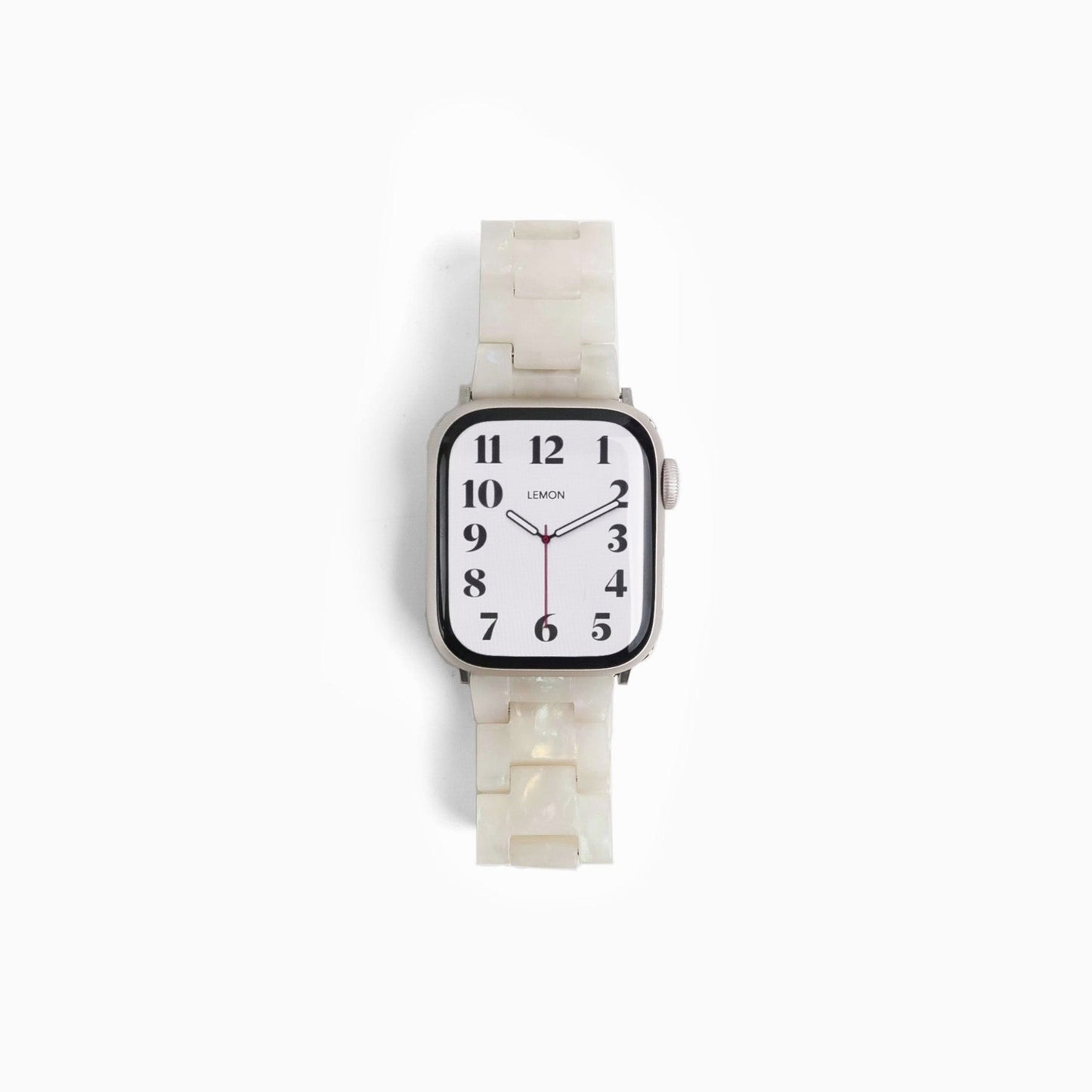Wristwatch with a white strap and face on a white background
