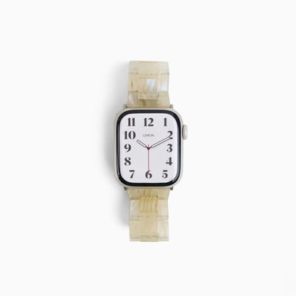 Polly Resin Apple Watch Band in starlight, angled view of the watch on white
