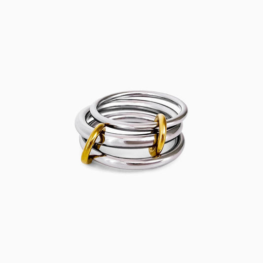 Sloane Linked Ring, three silver-tone bands joined by gold-tone loops, on a white background