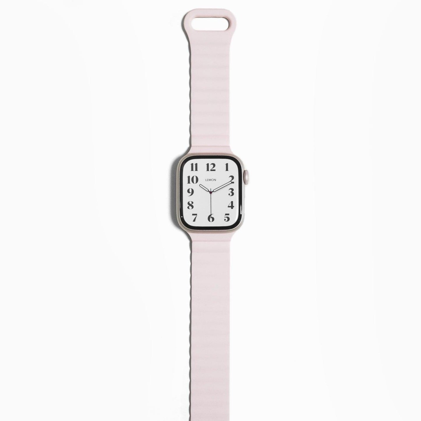 A light pink magnetic snap rubber band for Apple Watch, displayed on the watch wrist strap position.