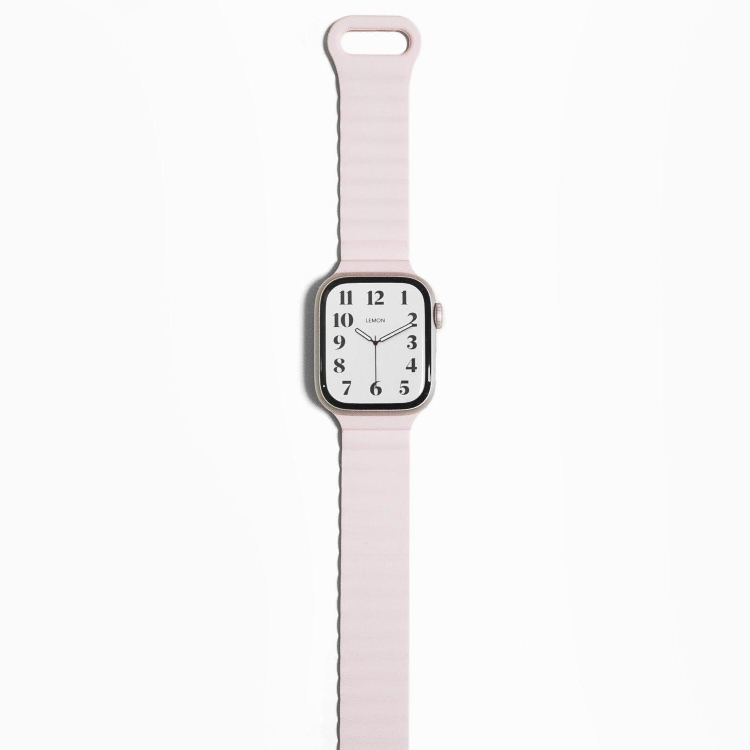 A light pink magnetic snap rubber band for Apple Watch, displayed on the watch wrist strap position.