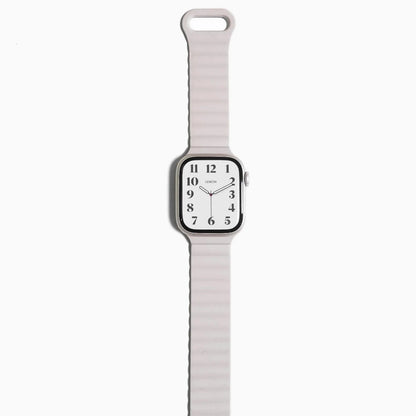 Magnetic Snap Silicone Apple Watch Band in starlight with watch attached, front view on white