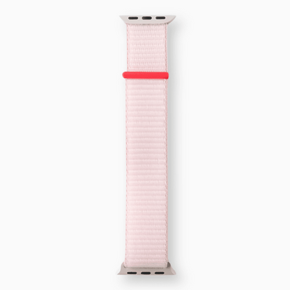 Soft Nylon Apple Watch Loop in pink with coral tab, full length woven strap on white