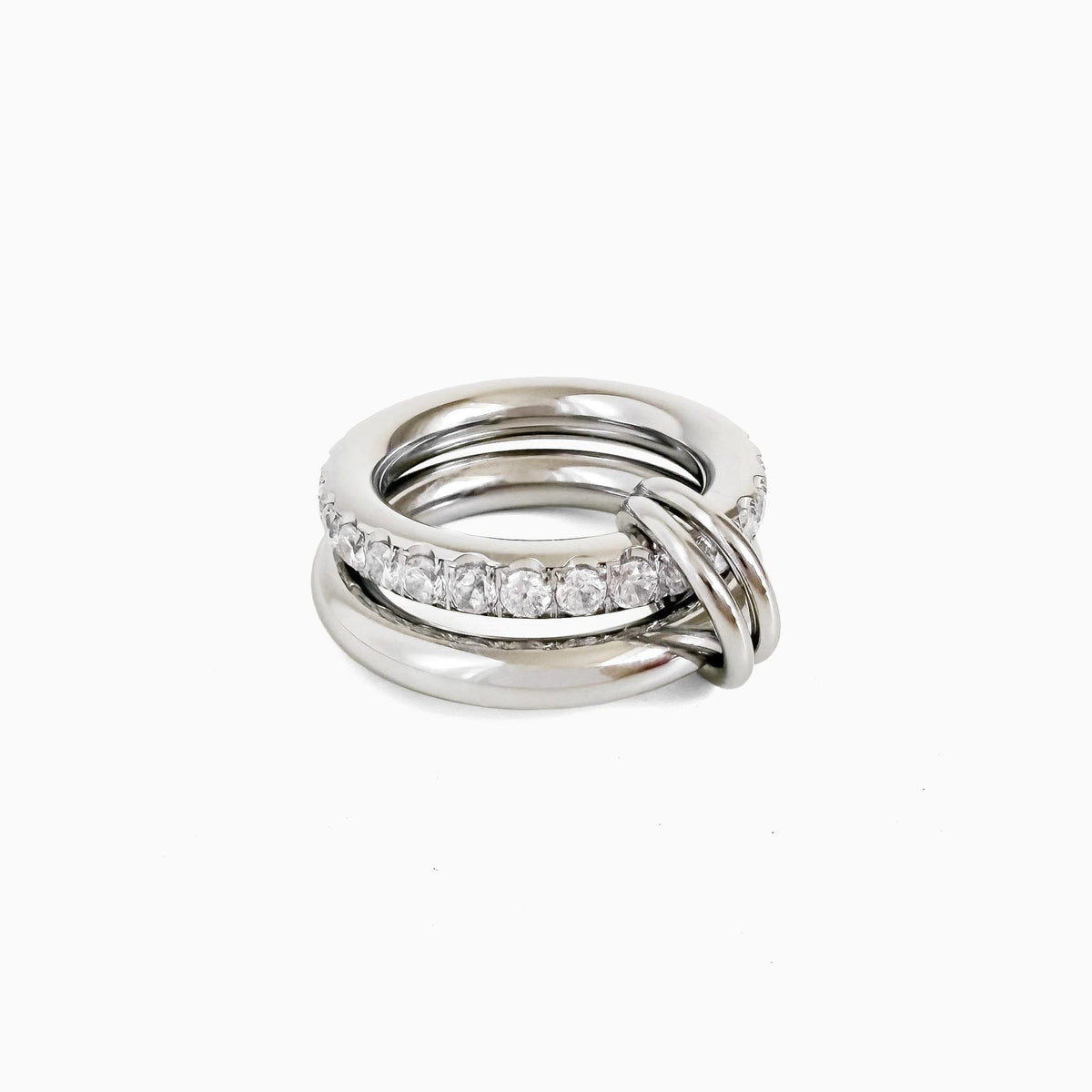 Sprinkled Donut Ring in silver, smooth silver-tone band stacked with a clear crystal band, on a white background