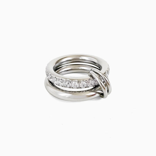 Sprinkled Donut Ring in silver, smooth silver-tone band stacked with a clear crystal band, on a white background