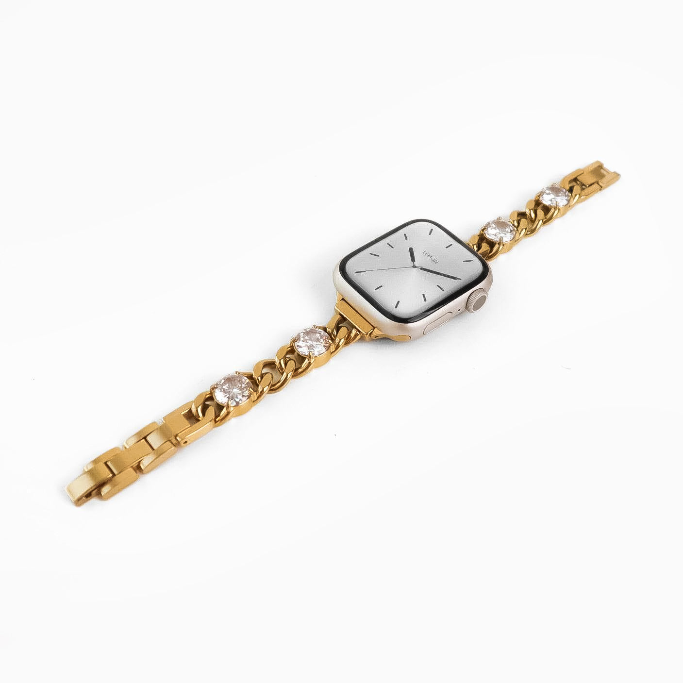 Gold watch with diamond-studded bracelet on a white background