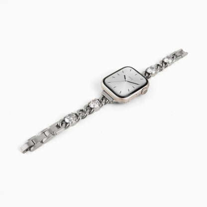 Blossom Apple Watch Band in silver stainless steel with crystals, angled view on white