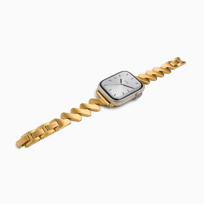 Lightning Apple Watch Band in 18k gold plated zigzag links, laid at an angle on white