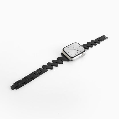 Lightning Apple Watch Band in black stainless steel, angled view of the bracelet on white
