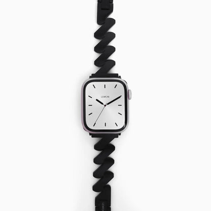 Lightning Apple Watch Band in black stainless steel, zigzag links, flat on white