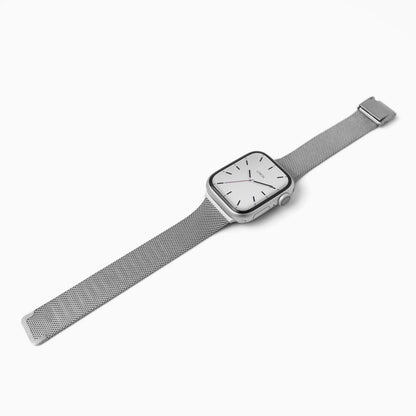 Slim Milanese Apple Watch Band in silver stainless steel mesh, laid at an angle on white