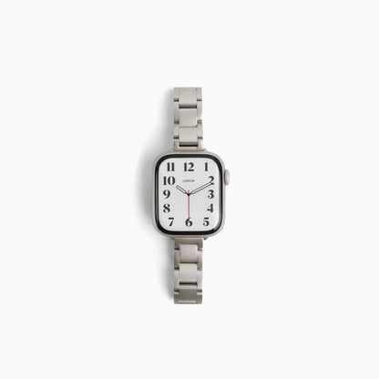 Slim Moon Apple Watch Band in starlight stainless steel, flat links on white